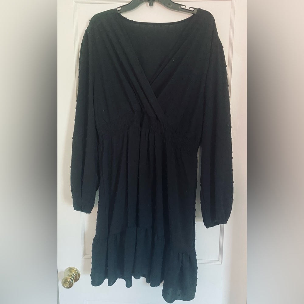 Black cocktail party dress with dot accents
